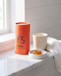 f°5 Daily tube on a bathroom shelf